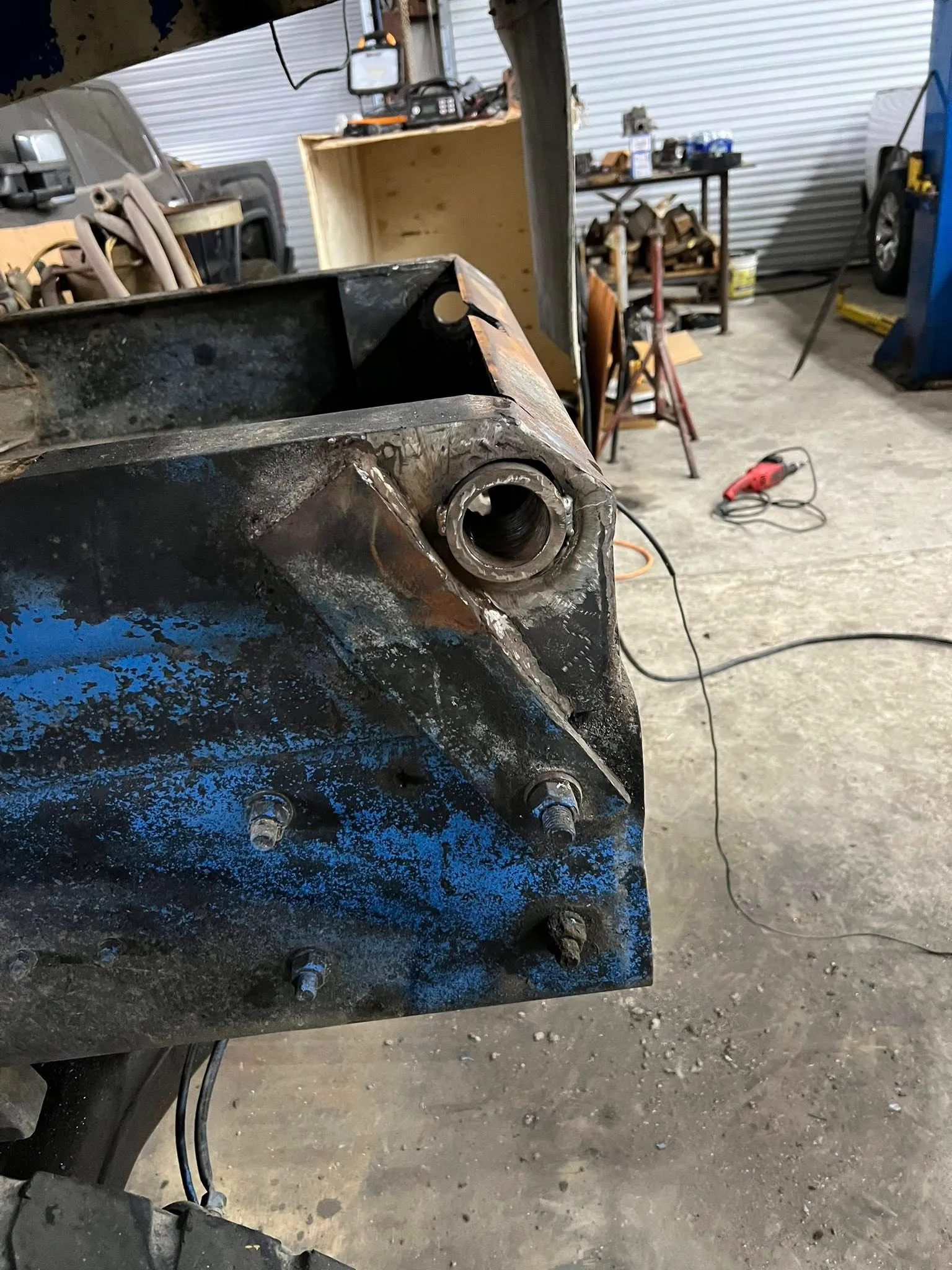 Frame mount repaired and re-bushed after grinding out the old weld